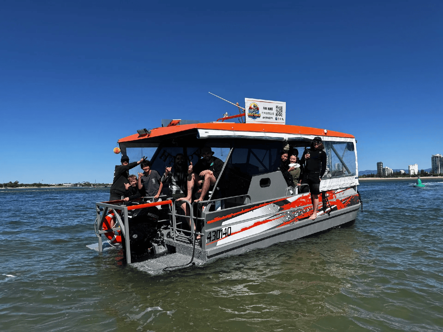 GC Jet Ski offers family friendly boat tours - image of a family enjoying their time in Gold Coast inside a fully kitted out pontoon.