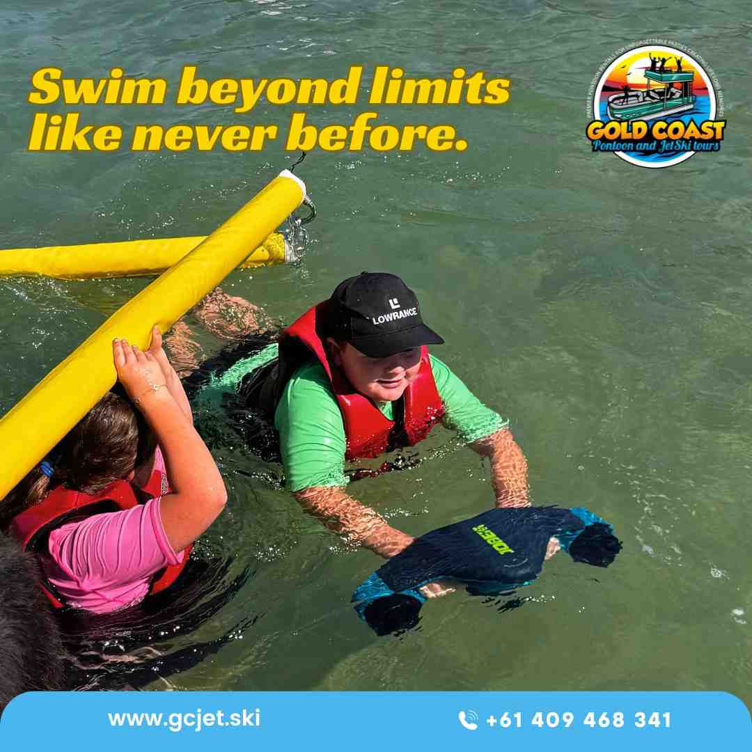 Two people, both children, happily swim with a board and a noodle, all while wearing life vests for safety - water activities for groups
