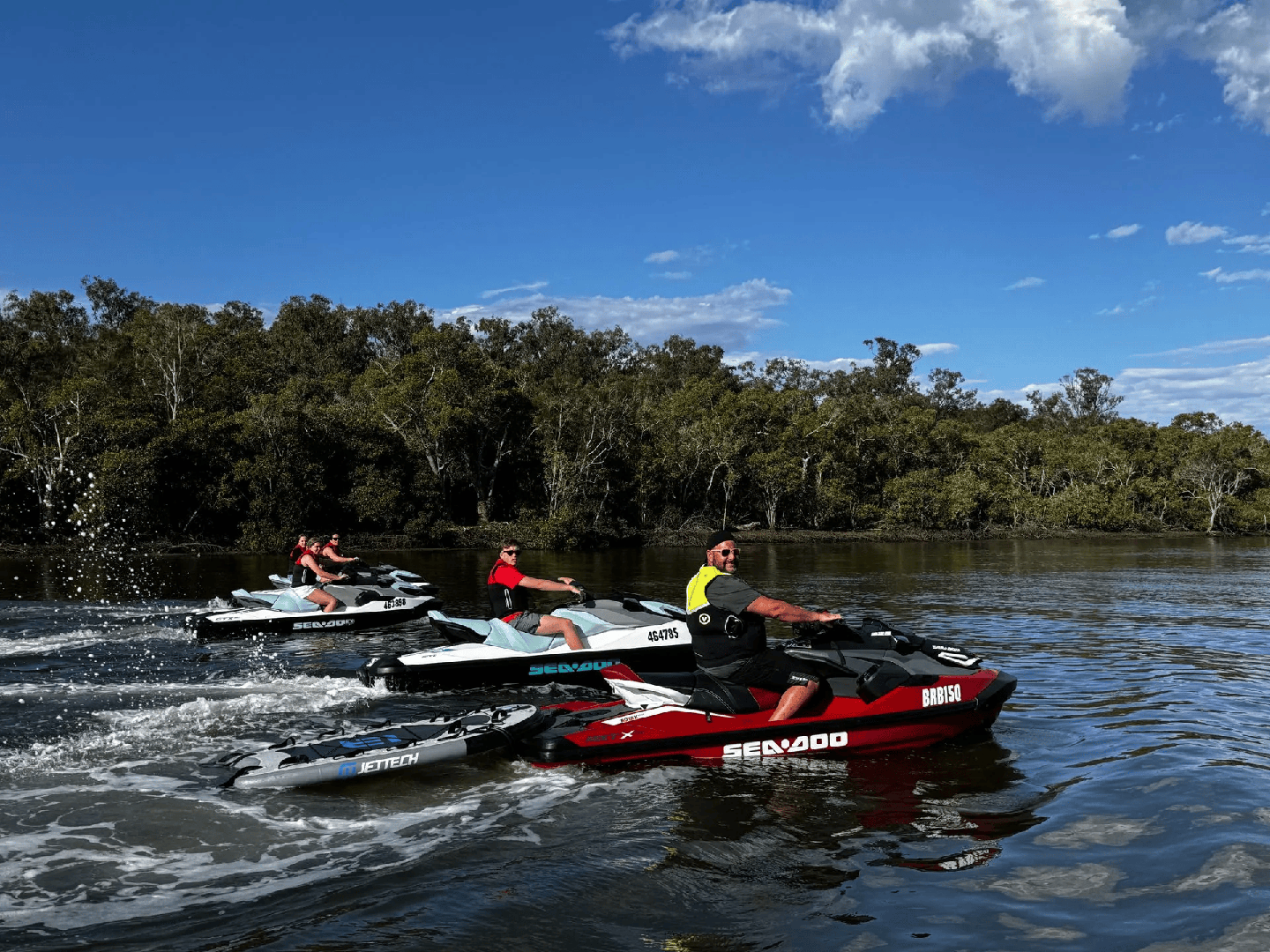 Detailed infographic showing water-jet propulsion system with arrows indicating water flow from intake through impeller chamber to high-pressure exit nozzle, including pressure and velocity measurements - how do jet skis work infographic 