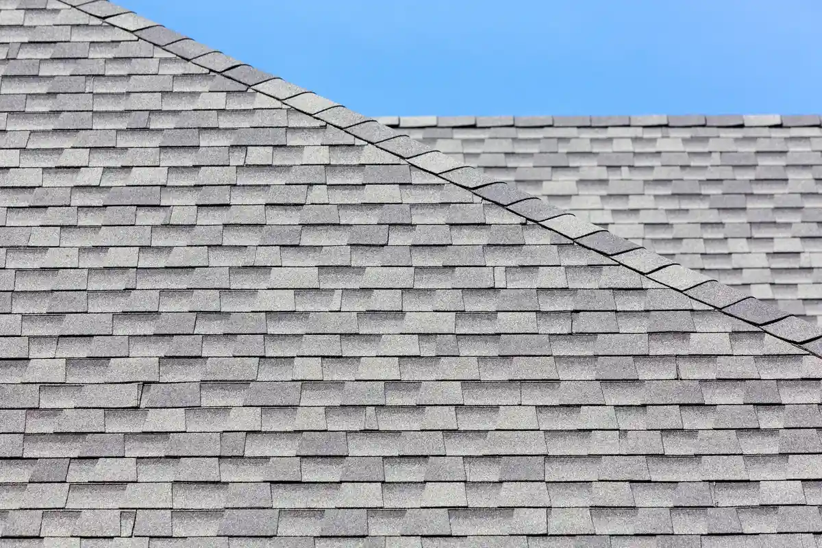 Roof with architectural shingles highlighting their dimensional look - composition shingle types Roof with architectural shingles highlighting their dimensional look - composition shingle types
