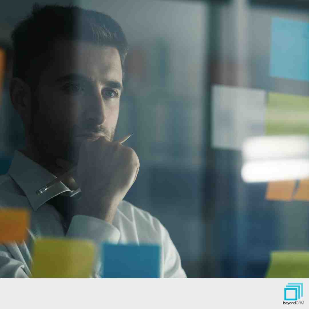 user-inserted Businessman thinking about membership CRM benefits for engagement and renewals.