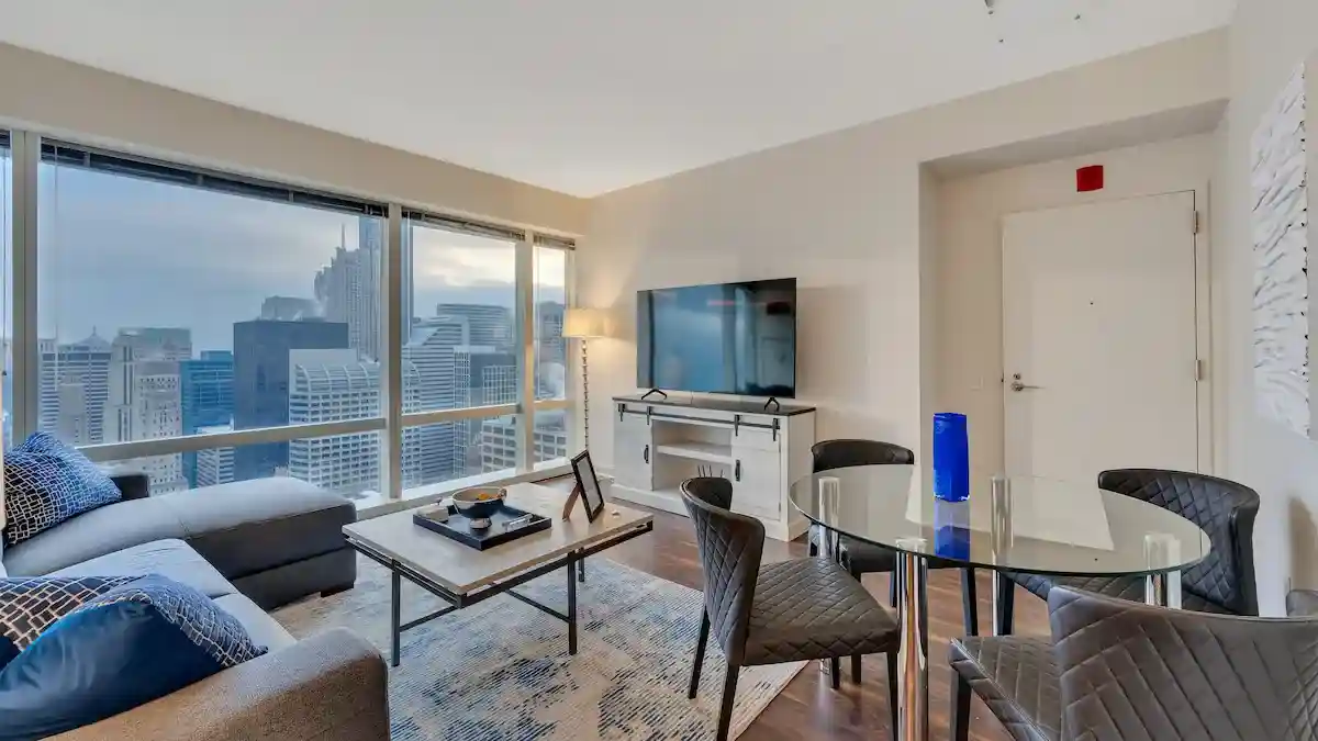 modern, fully furnished living room with floor-to-ceiling windows - all inclusive apartments Chicago