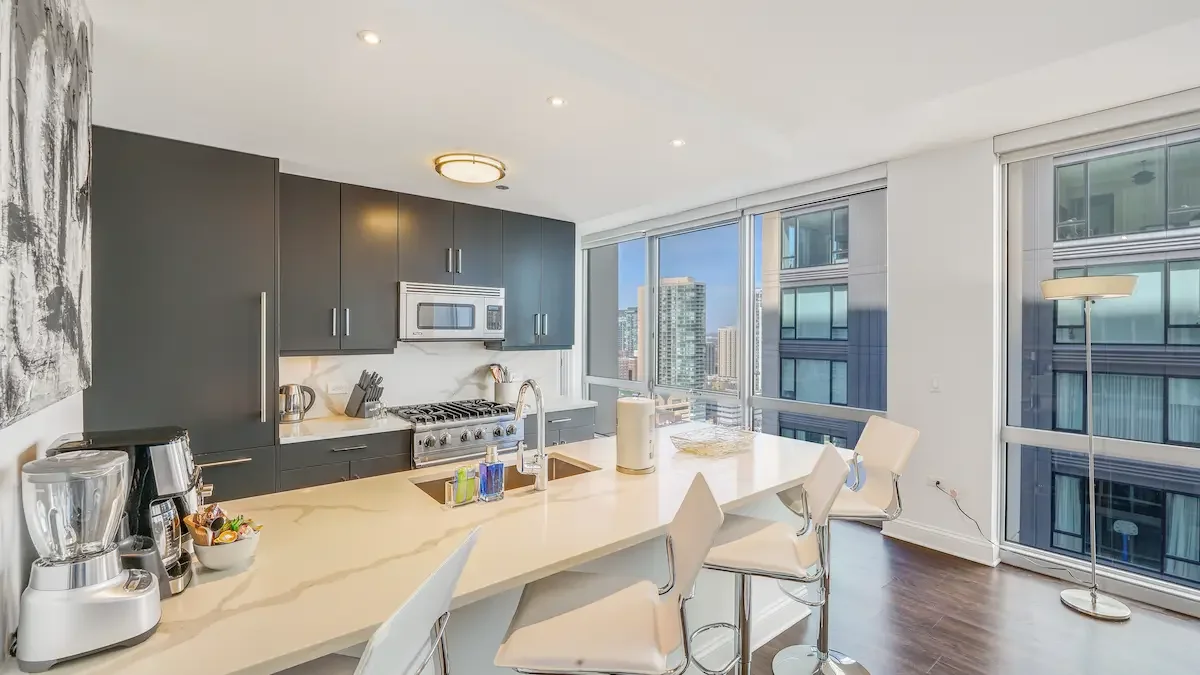 Modern move-in-ready kitchen with designer furniture in Gold Coast Chicago - short term apartments gold coast