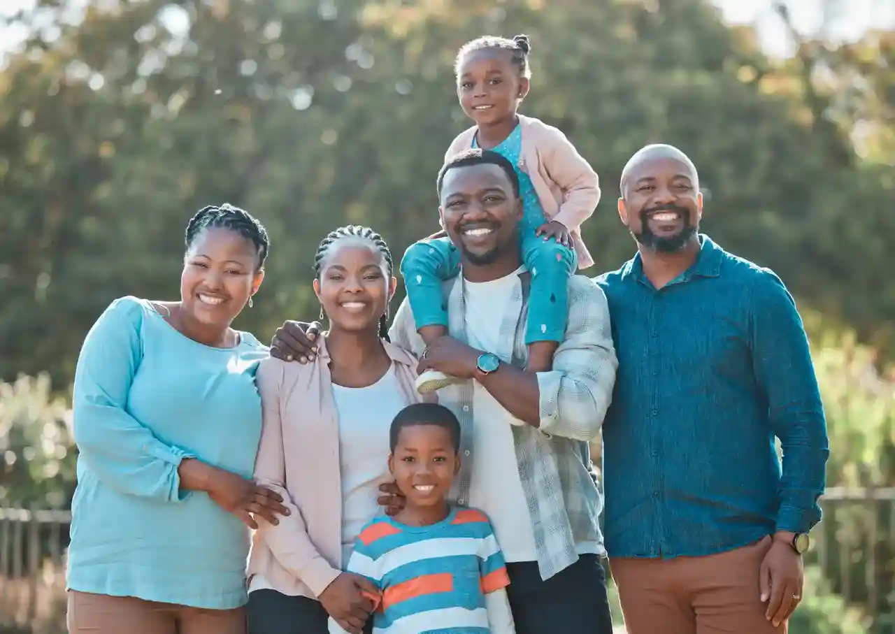 A family having a collaborative discussion around a table - estate planning for multi-generational wealth transfer