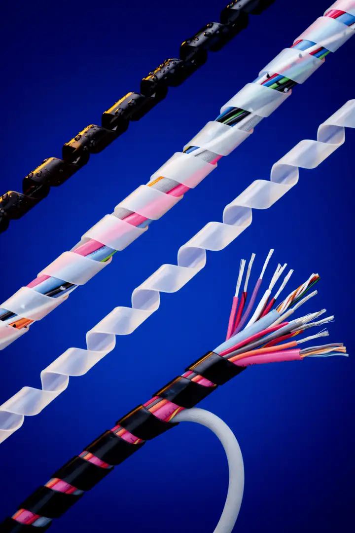 Infographic showing spiral wrap bundle with individual wire breakouts exiting at multiple points along the wrap infographic Infographic showing spiral wrap bundle with individual wire breakouts exiting at multiple points along the wrap infographic