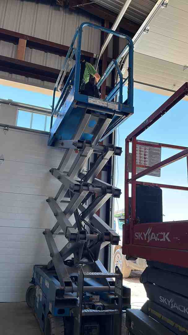 Service technician working on an RV garage door - rv garage door repair