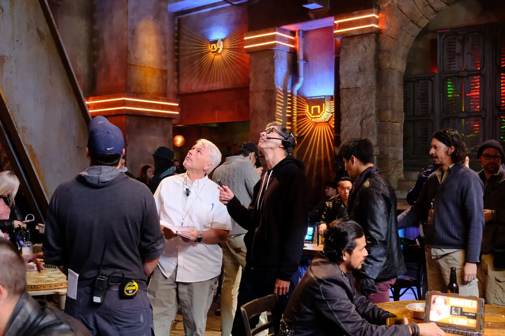 Production crew collaborating on a sci-fi set at Troublemaker Studios in Austin, Texas