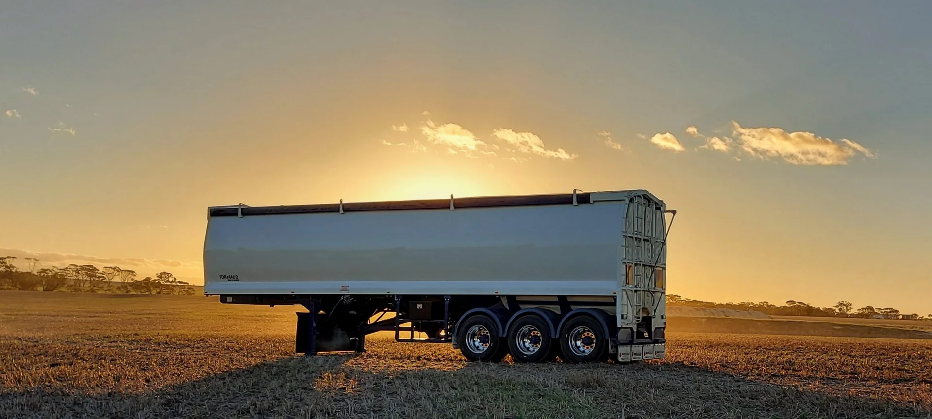 A Duraquip seed bin with a roll over tarp system, showcasing different custom truck tarping solutions. A Duraquip seed bin with a roll over tarp system, showcasing different custom truck tarping solutions.