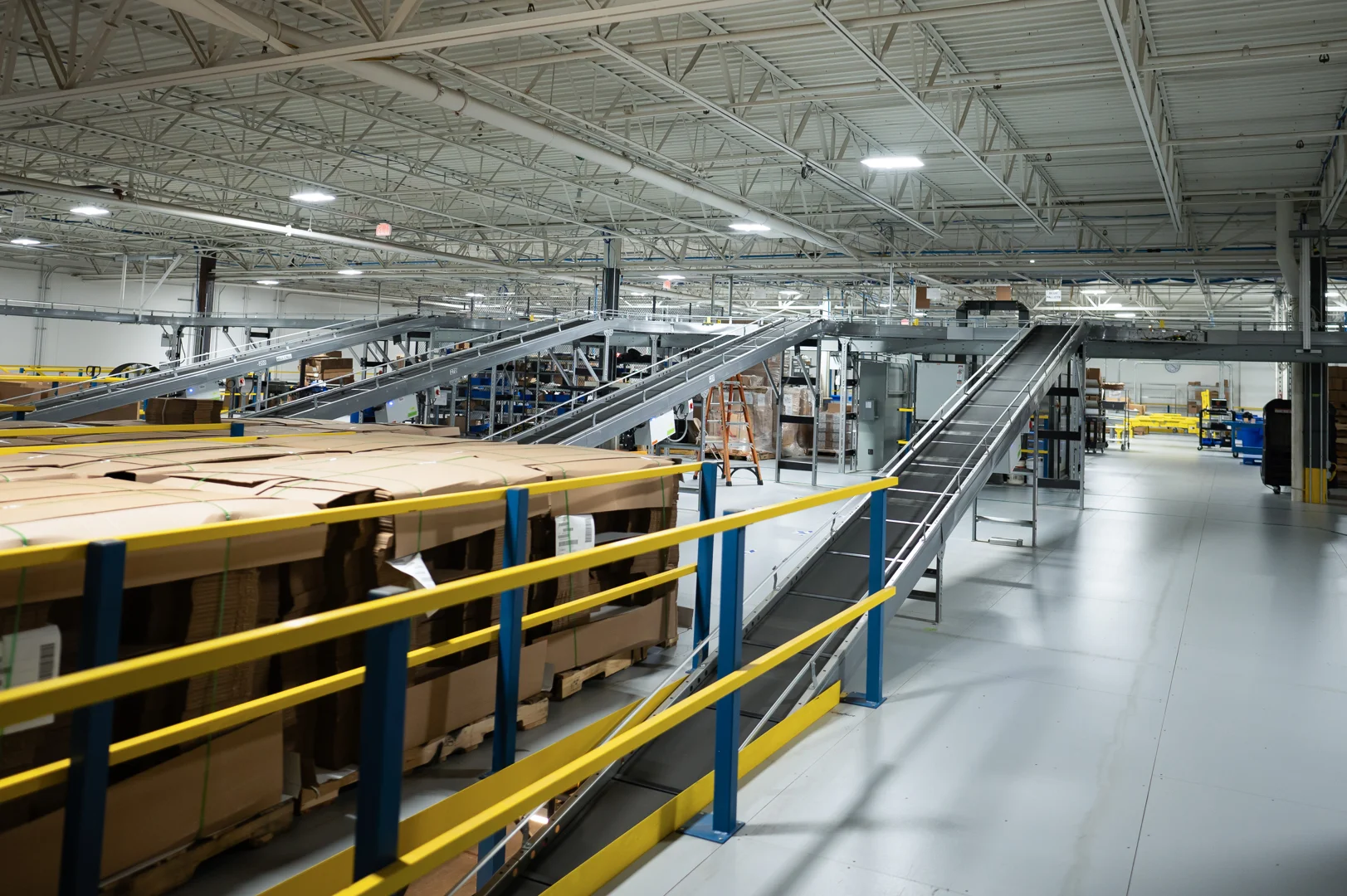 elevated conveyor system moving materials through an automated warehouse