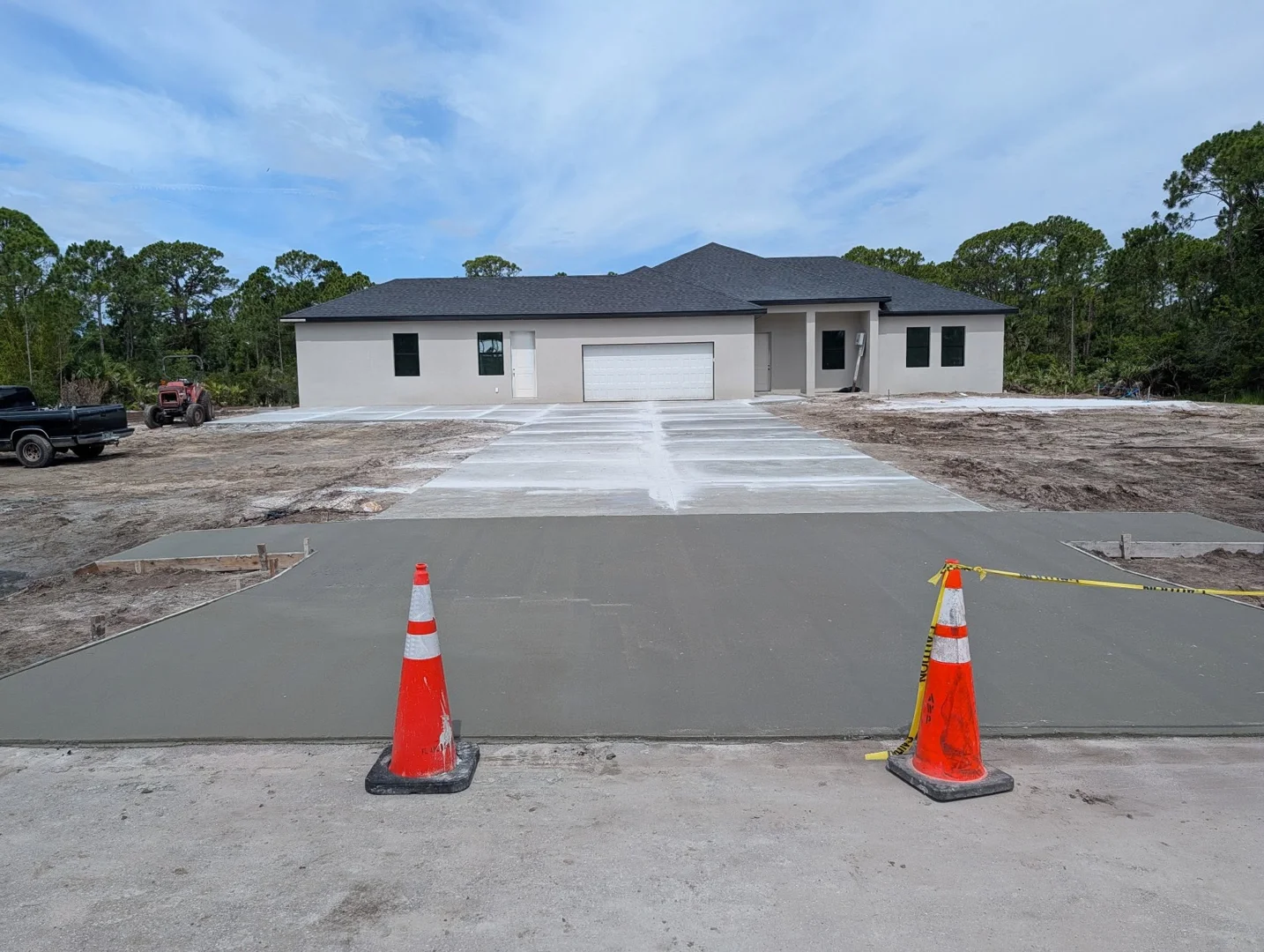 Newly completed concrete driveway at a residential construction site Newly completed concrete driveway at a residential construction site