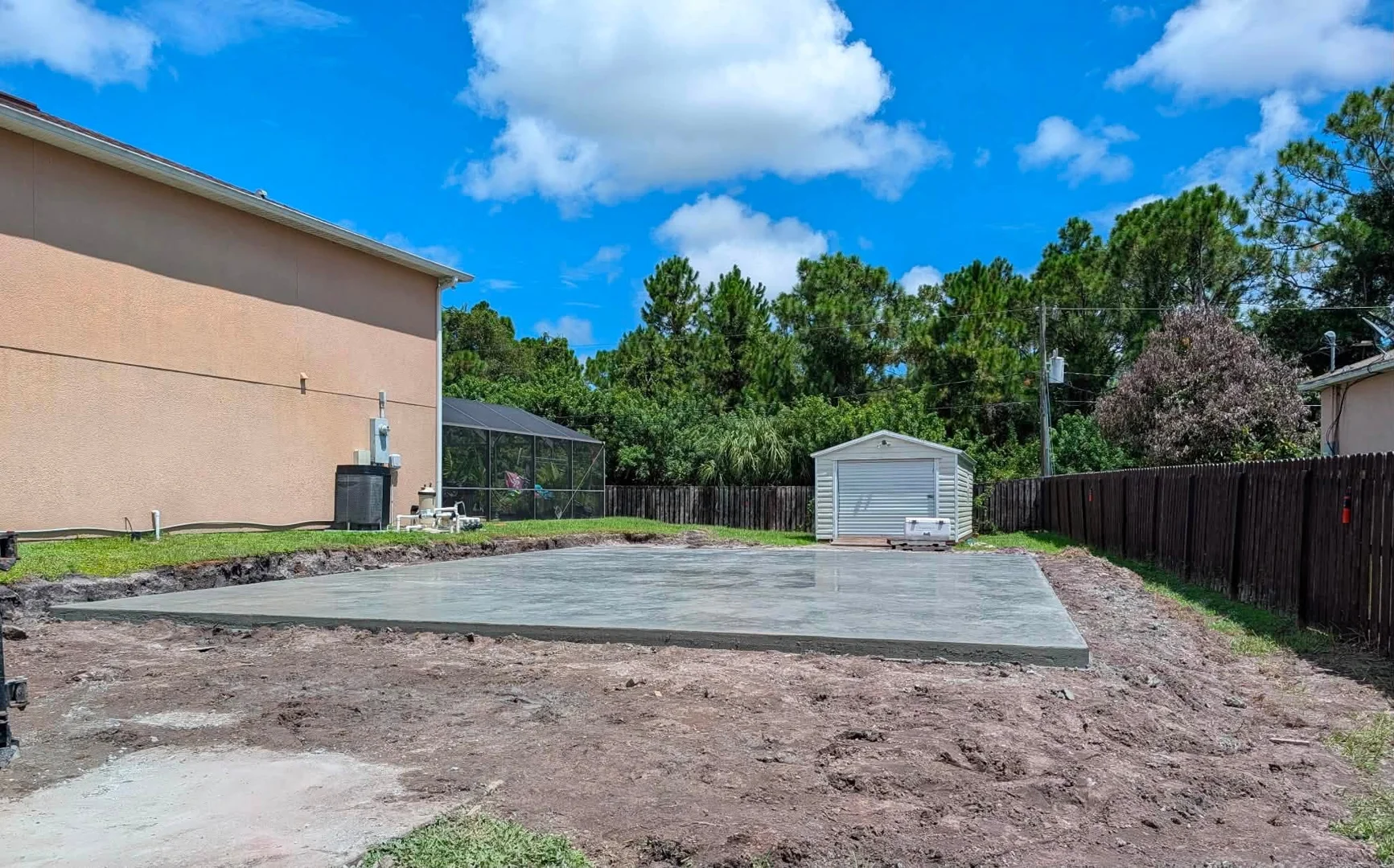 Fresh concrete slab in a residential backyard Fresh concrete slab in a residential backyard