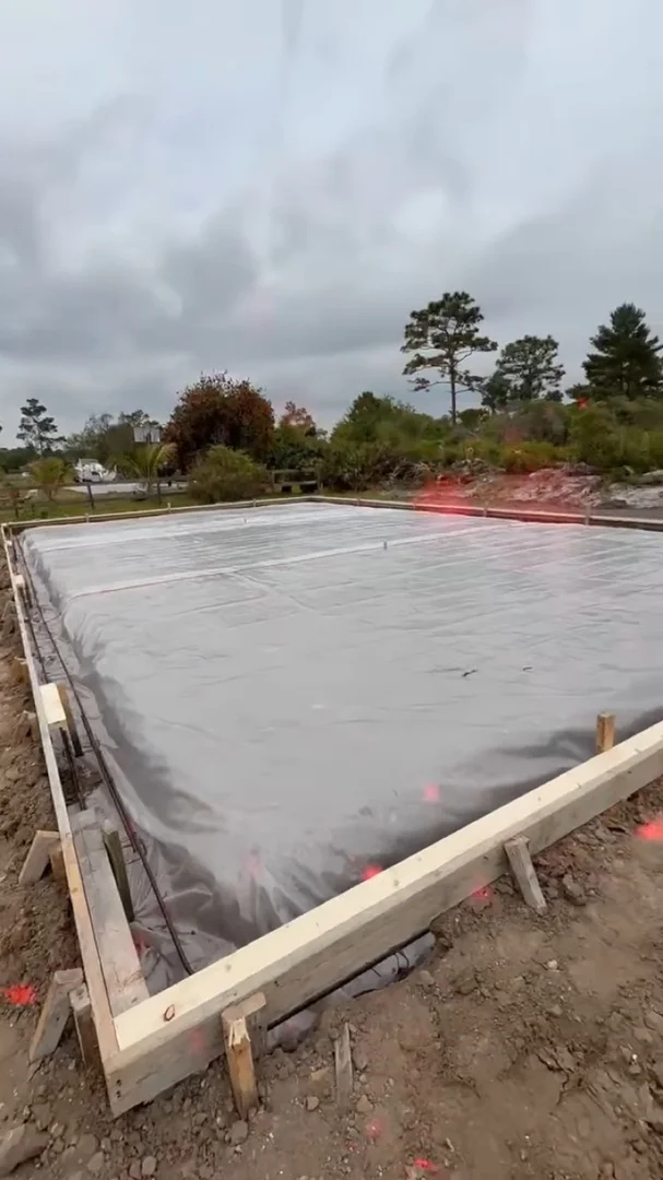 Formed slab area covered with sheeting before concrete placement Formed slab area covered with sheeting before concrete placement
