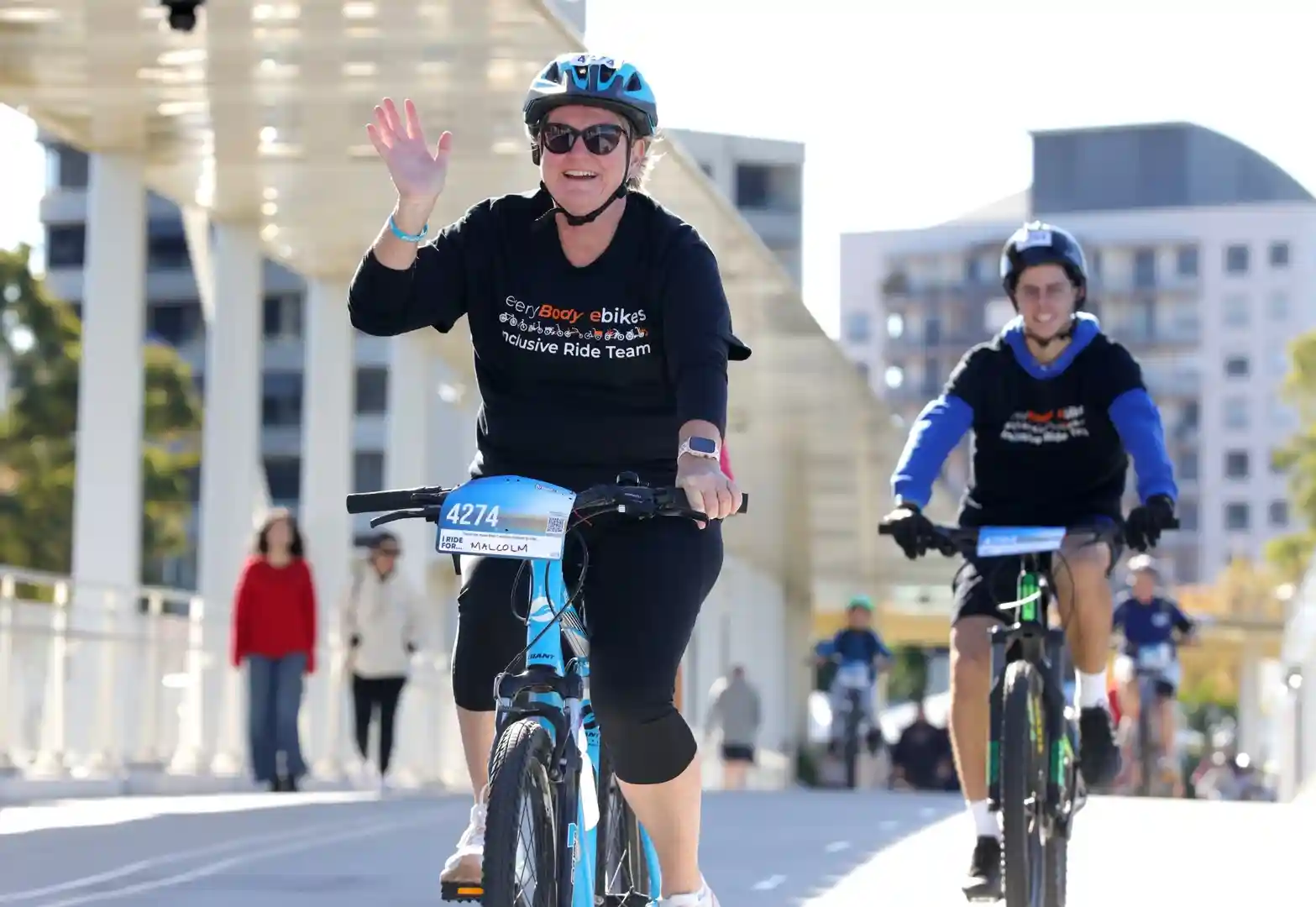 A diverse group of people riding different e-bikes and trikes together on a scenic path. - e bike fix near me