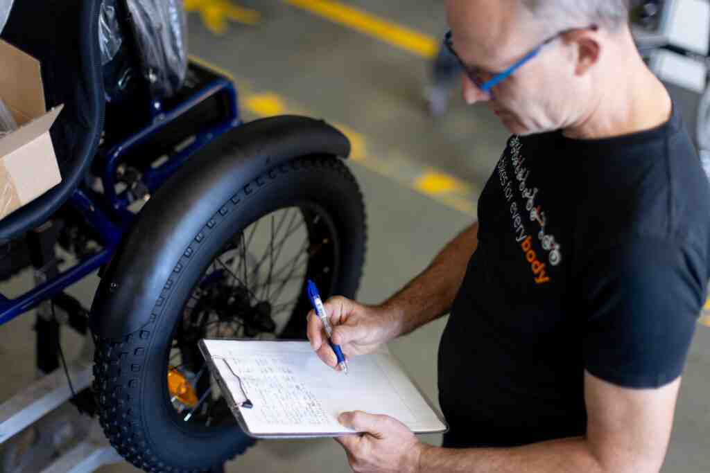 A friendly expert doing the final checks in your eBike