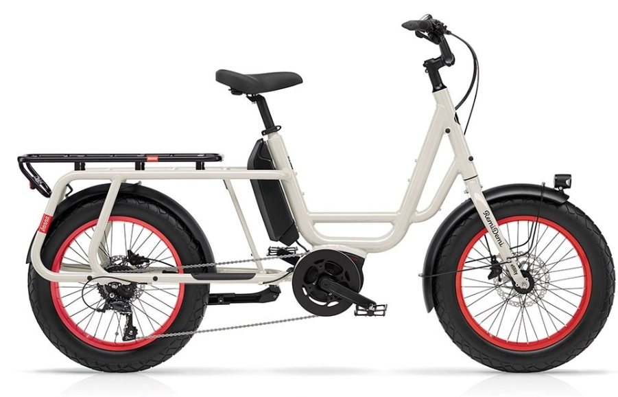 the Benno RemiDemi XL parked in a vibrant urban setting, showcasing its compact frame and fat tyres. - Benno bikes
