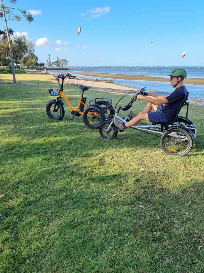 user-inserted Trident semi-recumbent electric tricycle with comfortable reclined seat, three wheels, and sturdy frame for stable riding.