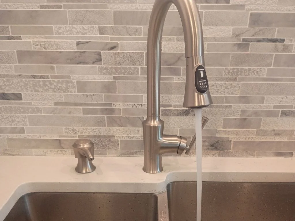 Running water on newly installed kitchen faucet in Largo