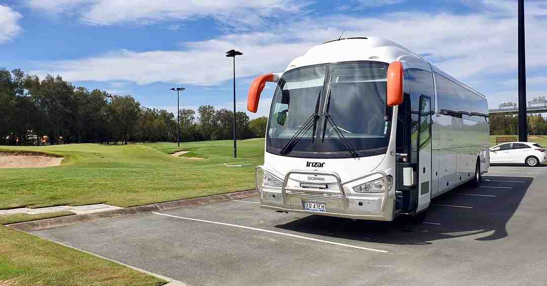 Corporate team boarding a modern executive minibus in Brisbane