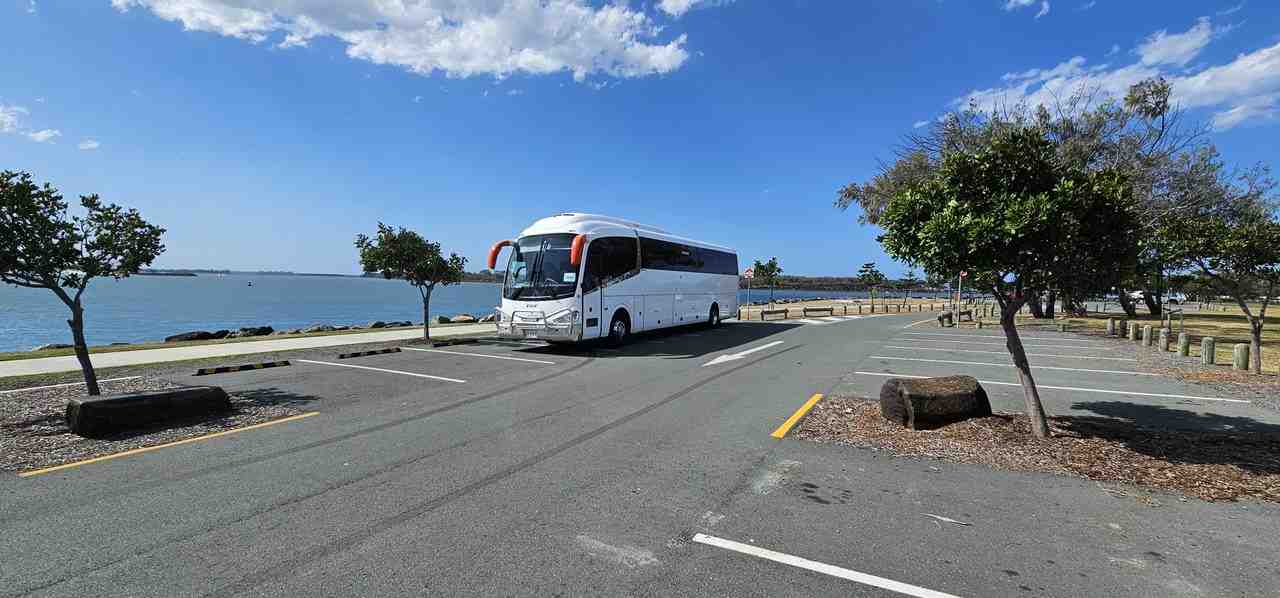 Corporate group stepping off modern mini bus in Brisbane - mini bus hire for corporate meetings
