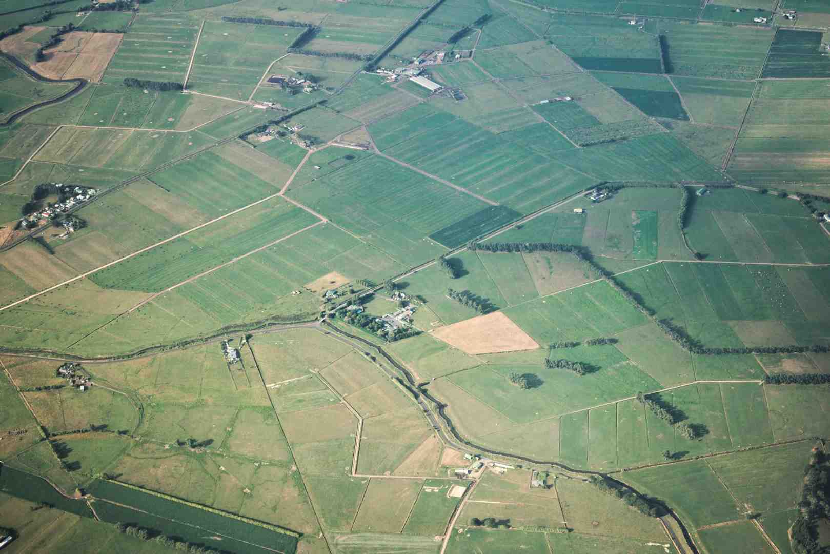 aerial view of suburban land plots marked with property lines, showcasing potential residential development opportunities