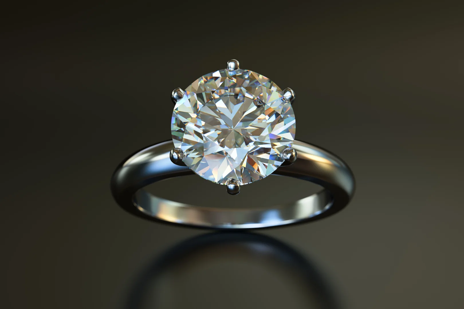 A six-prong diamond solitaire engagement ring with petite prongs on a reflective dark grey background.