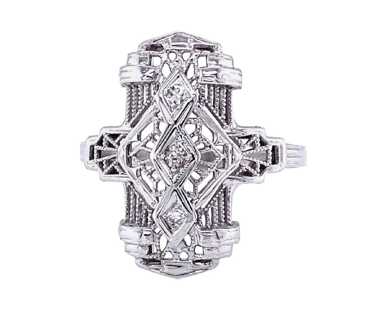 An antique Art Deco diamond filigree ring on an isolated white background.
