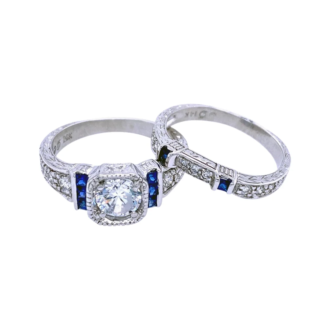 An antique-style wedding ring set with diamonds and blue sapphire accents.