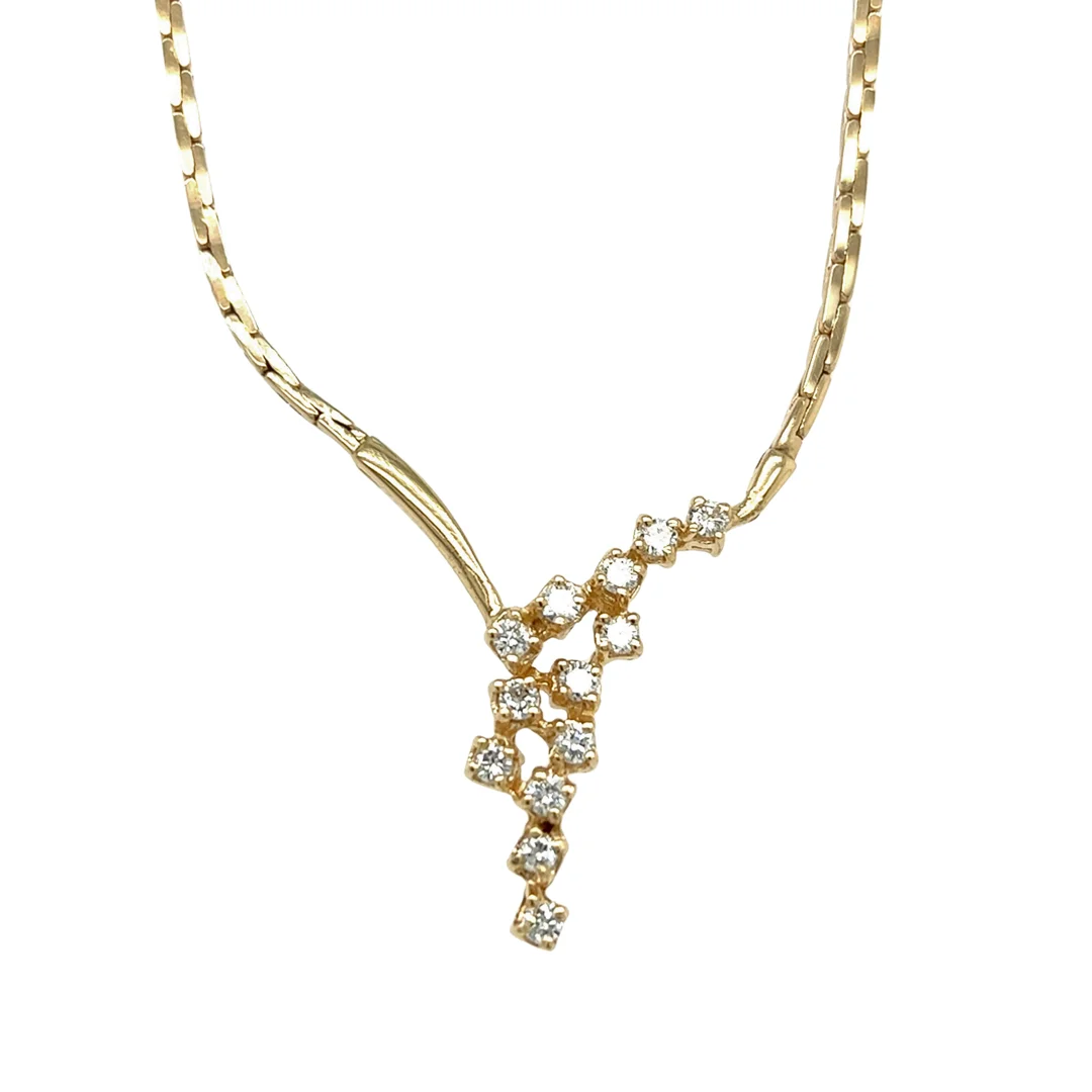 A yellow gold diamond cluster necklace on an isolated white background.