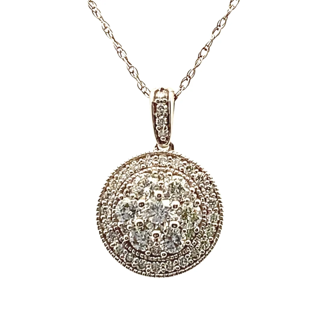 A diamond cluster pendant necklace on an isolated white background.