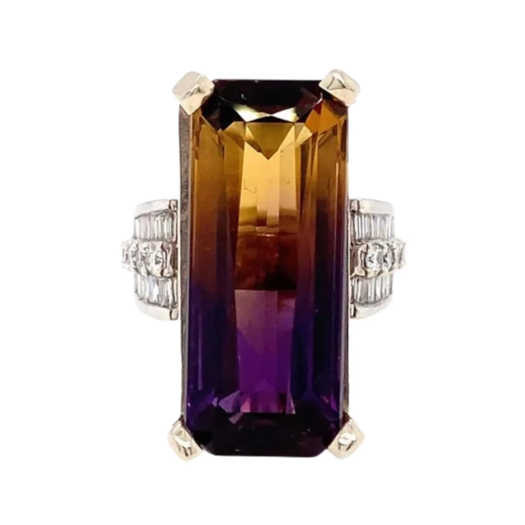 user-inserted A fashion ring with an elongated emerald-cut ametrine and diamond accents on an isolated white background.