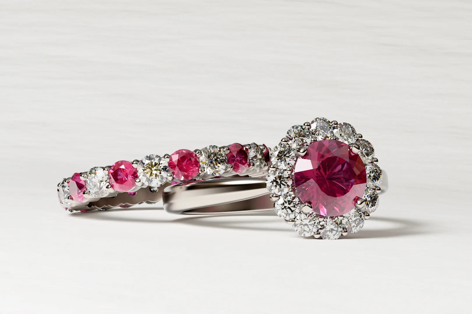 A ruby and diamond wedding ring set in white gold on a white beige background