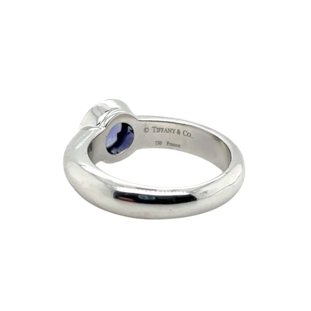 user-inserted A vintage Tiffany & Co. 18K white gold and iolite ring with a visible "Tiffany & Co." maker's mark. The ring is on an isolated white background.