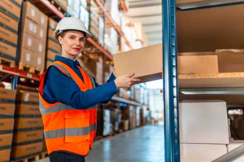 warehouse worker carefully inspecting item - The Human Side of 3PLs: Customer Service Beyond Shipping