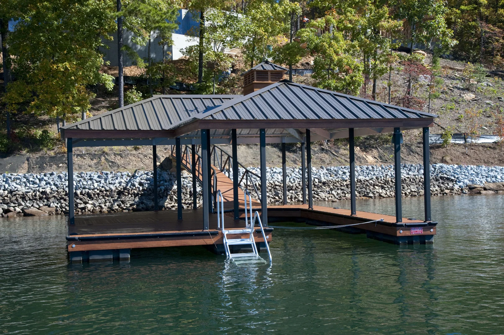 A modern architectural boat dock with clean lines and steel accents - boat dock aesthetic designs