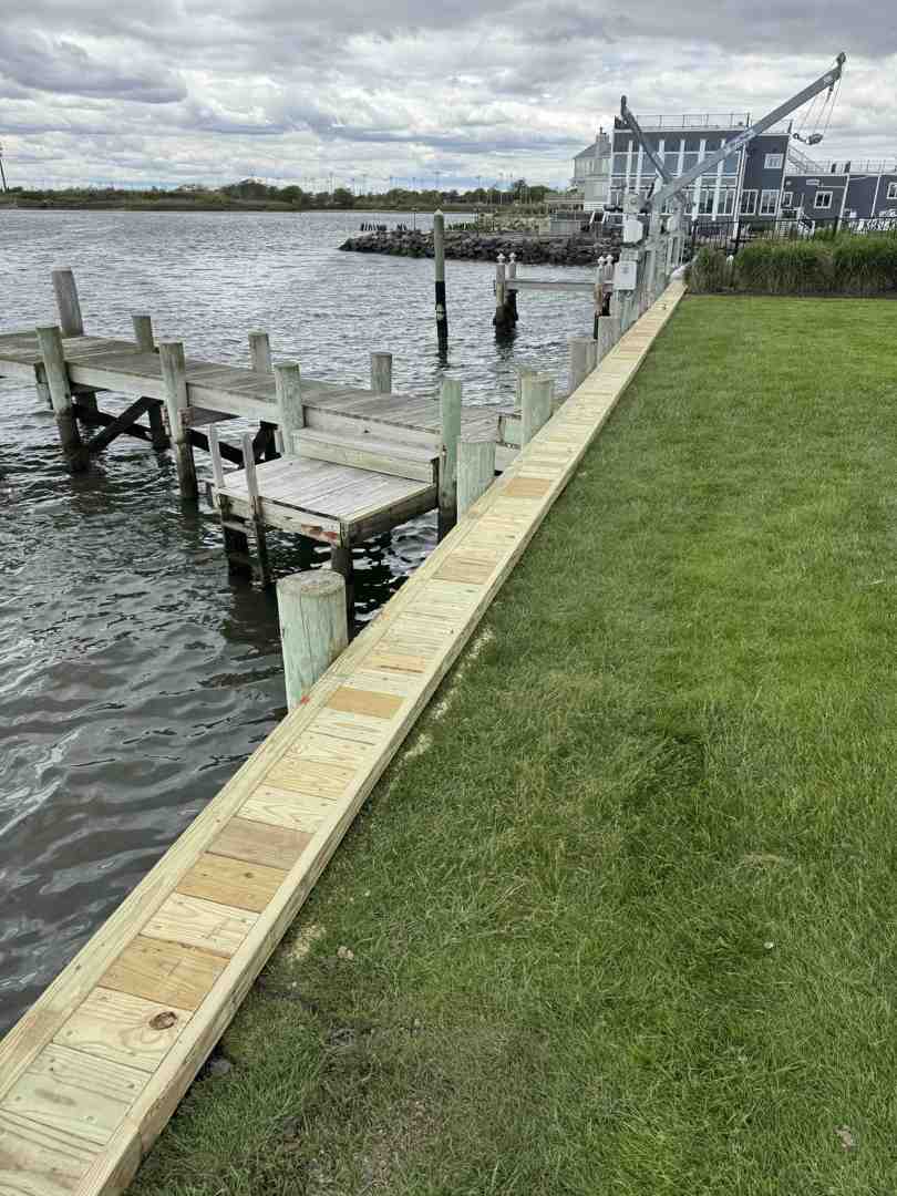 floating dock securely anchored in Long Island bay - Floating dock anchoring hardware