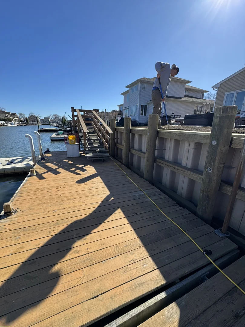 Marine contractor evaluating concrete seawall Marine contractor evaluating concrete seawall
