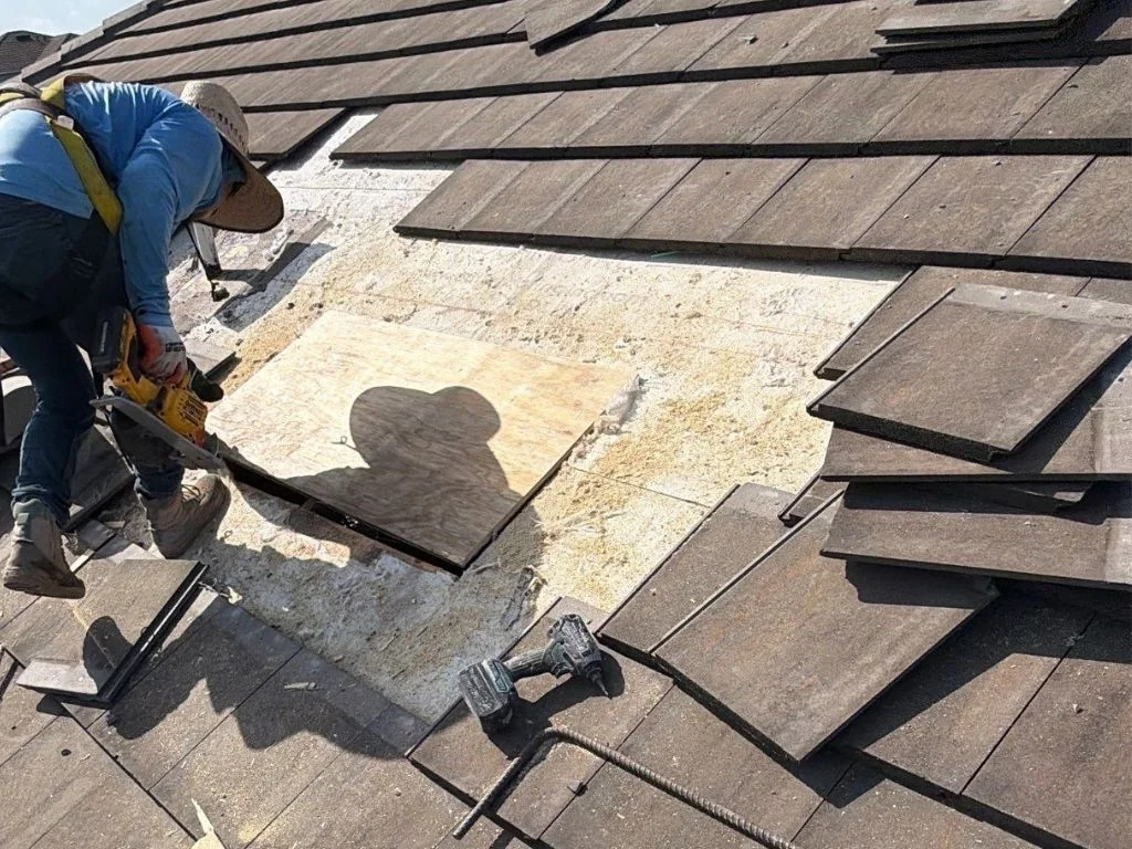 user-inserted Water-damaged roof decking and torn underlayment from delayed roofing maintenance.