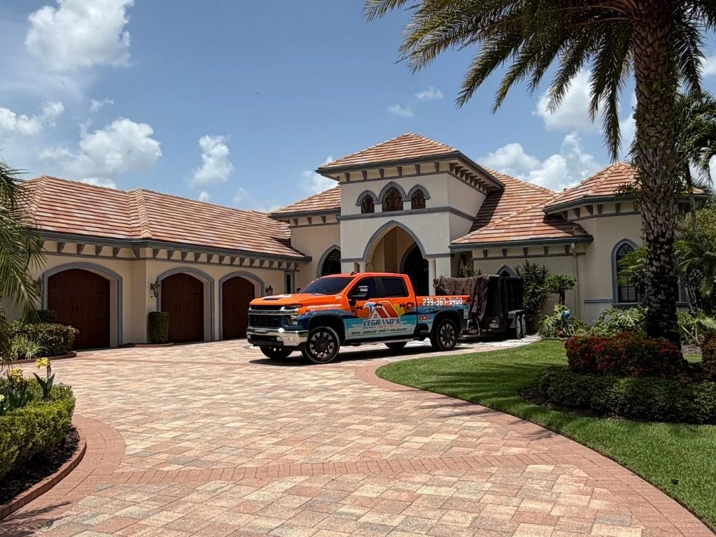 user-inserted Residential roofing contractor inspecting water-damaged roof decking and underlayment.