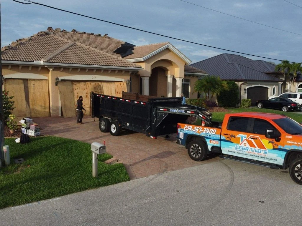 Roof repair contractor assessing storm damage to a home's roof.