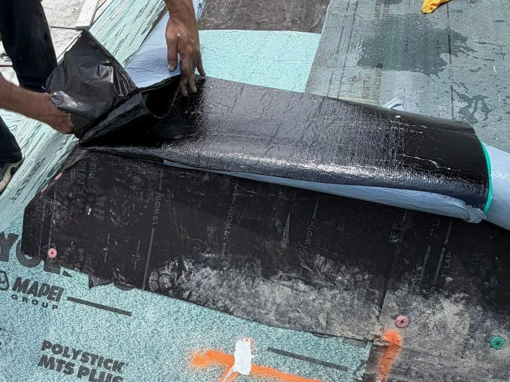 Roof waterproofing membrane protecting against storm damage, highlighting the need for prompt reporting.