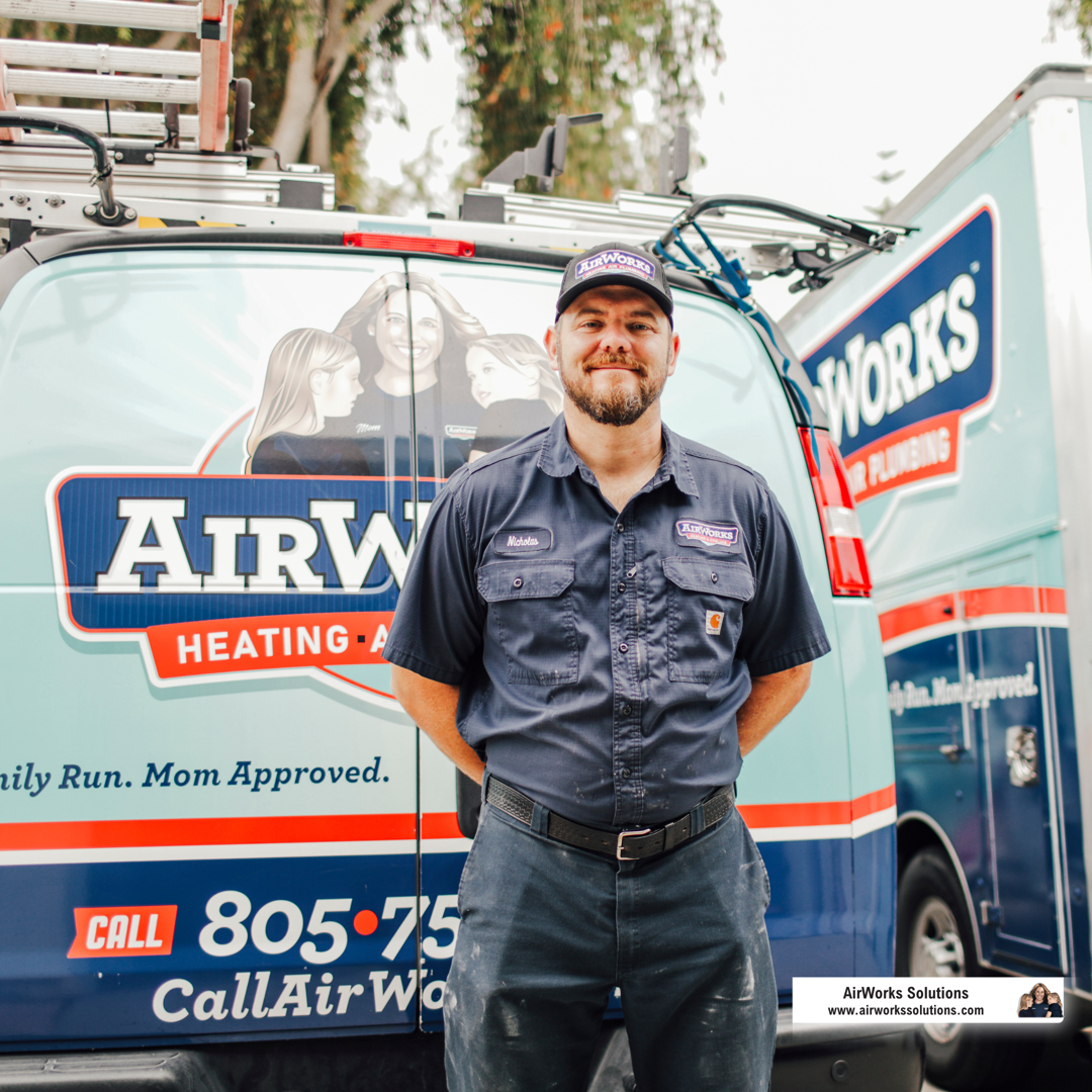 friendly, professional technician with a logo on their shirt - hvac tune up roseville
