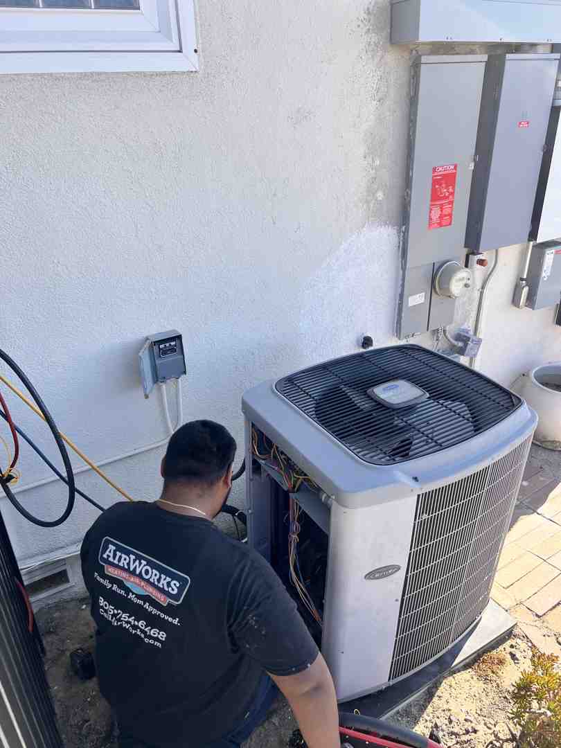 homeowner changing air filter - Camarillo AC installation