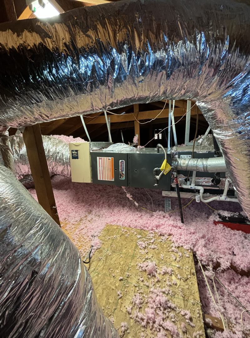 A homeowner reviewing documents with an insulation contractor - attic insulation sacramento ca
