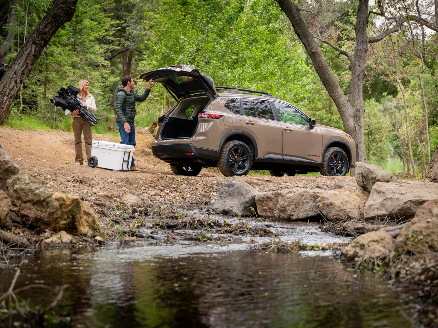 2026 Nissan Rogue and Pathfinder parked in a suburban setting