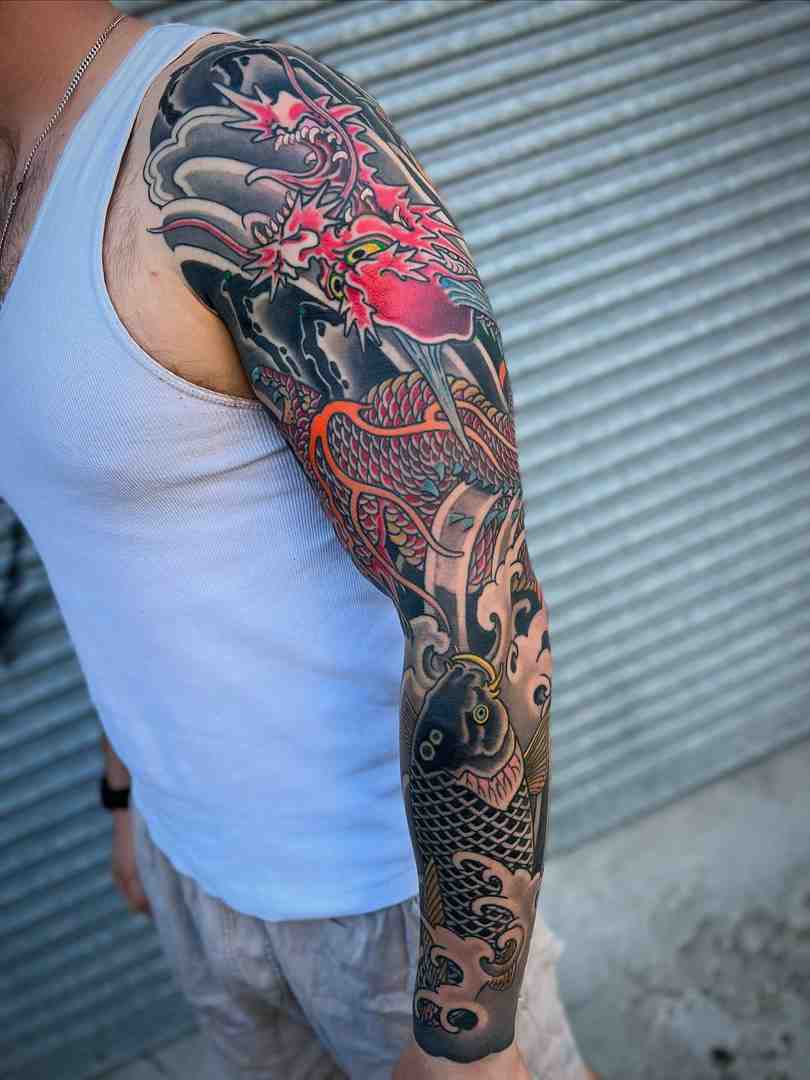 user-inserted Koi fish tattoo sleeve design on arm