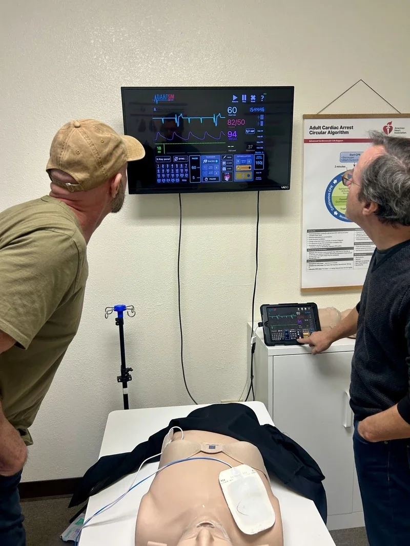 medical training classroom with students practicing acls scenarios - acls class price