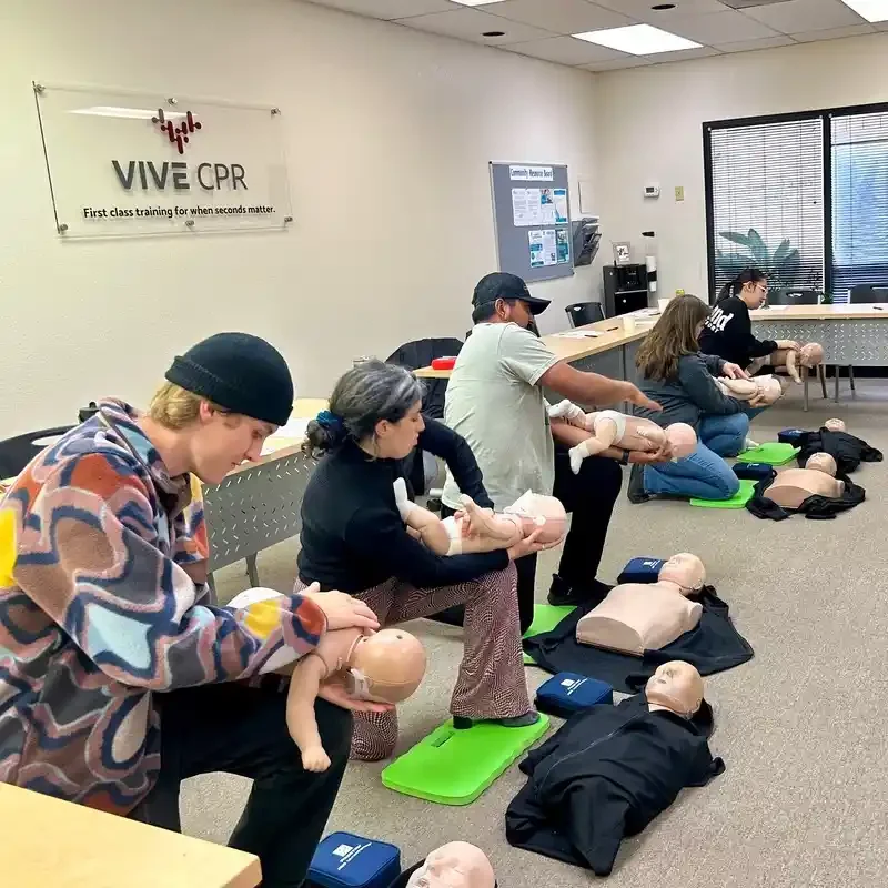 Instructor demonstrating AED use on a manikin - AHA CPR Sonoma County