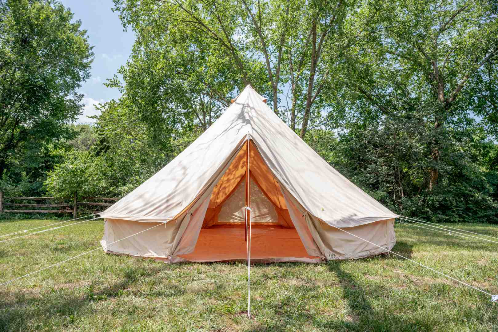 Interior of a 6m bell tent showing multiple beds arranged inside - 12 man bell tent Interior of a 6m bell tent showing multiple beds arranged inside - 12 man bell tent