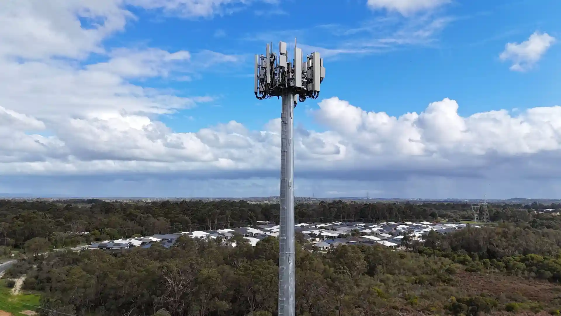 A monopole tower with multiple antenna arrays mounted, showcasing its capacity for various telecommunication services - Monopoles Telecommunication Towers