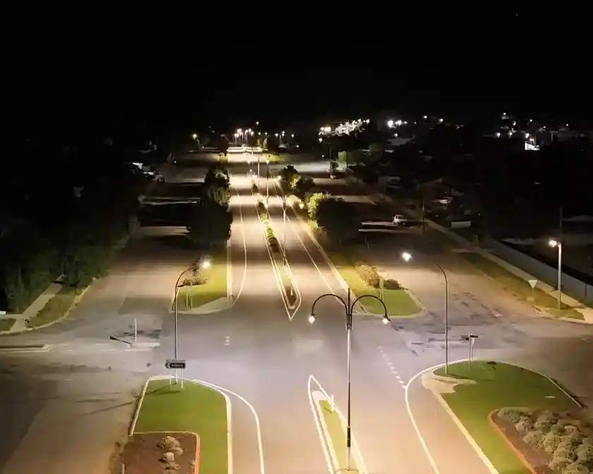 Solar powered street lights illuminating a modern urban park at night, showing improved safety and aesthetics. - are street lights solar powered